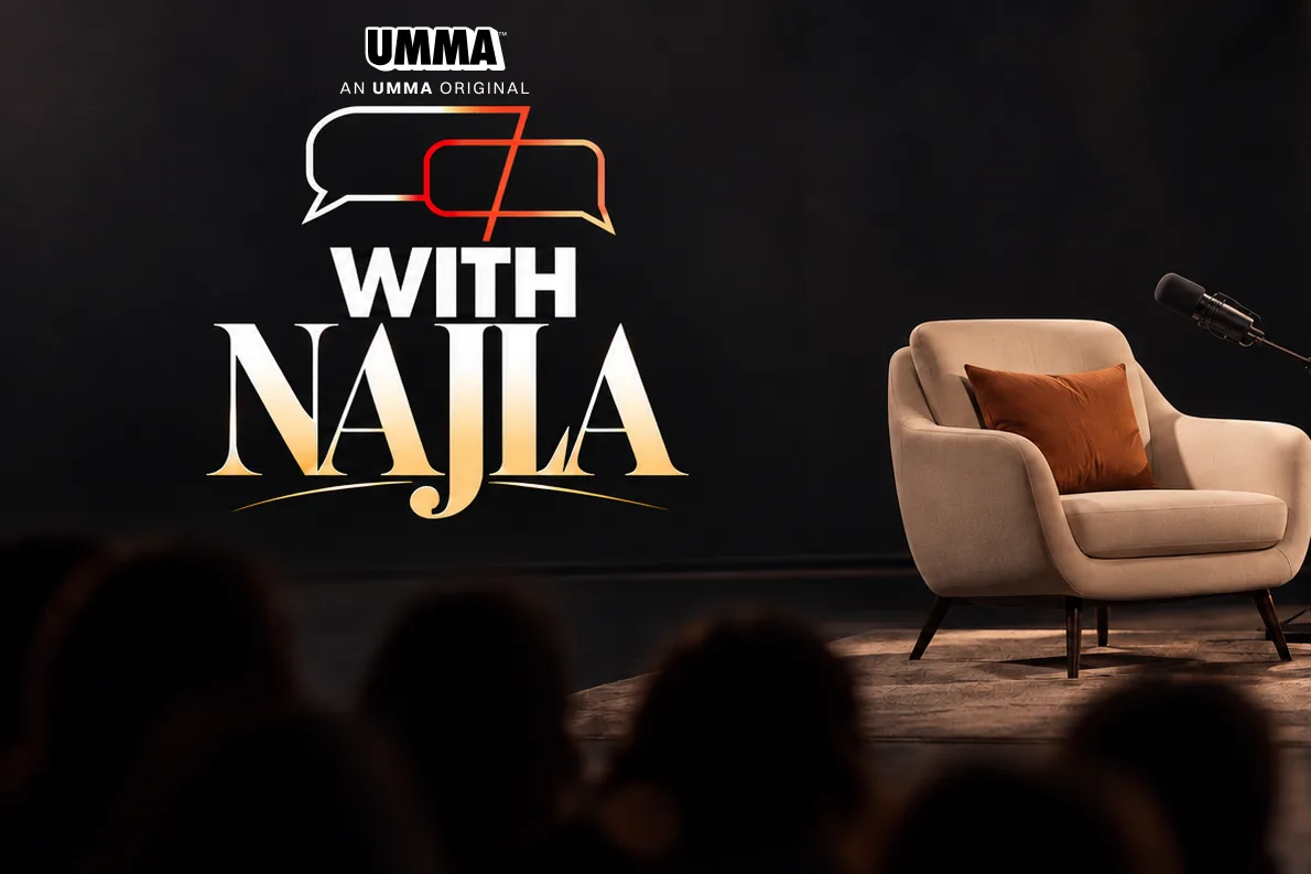 The With Najla set: an armchair under a studio microphone, the show's logo on the wall behind, and an audience seated in the dark.